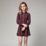 Kiernan Shipka barefoot wearing a plaid dress