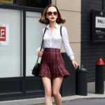 Picture of Natalie Portman in a plaid pleated skirt.