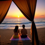 Sunset on the beach. A couple lays on a colorful towel on the sand. The vantage point is from the couple looking out, so only their legs on the towel are showing with all of the scenery