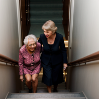 Taylor Swift pushing an old lady down the stairs