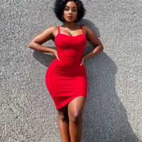 beautiful black woman in red dress with short black hair, full body view